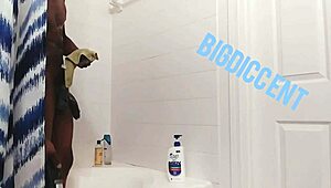Guy strokes big dick in shower off the clock