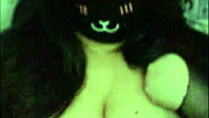 a goth girl teases her massive tits live on webcam.