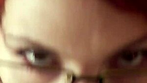 glasses-wearing karla rose kneels in pov locking eyes as she sucks my wrapped cock hungrily