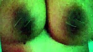 Latina amateur slips dildo in while shaking big natural tits like a slut at home.