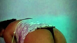 Latina amateur slips dildo in while shaking big natural tits like a slut at home.