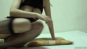 booty babe teases cameltoe in fishnets and thong