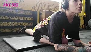 sexy tattooed alternative stretches teasingly in gym