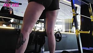 sexy tattooed alternative stretches teasingly in gym