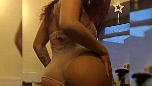 hey check out this sexy redhead cam girl shaking her juicy big tits