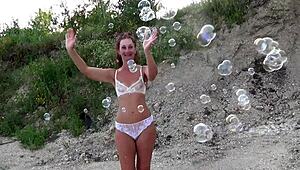 Mature Crossdresser Covers Transparent Bikini in Soap Bubbles