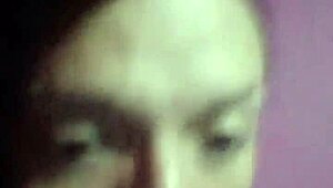 Natural titted ladyboy teases erotically in tight pink shirt