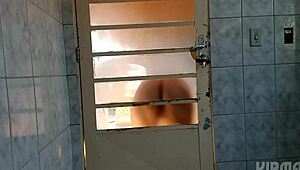 Behind the door crossdresser shakes ass in fascinating twerk display