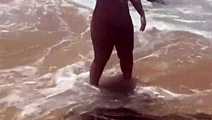 young african exhibitionist strips fully nude on crowded beach