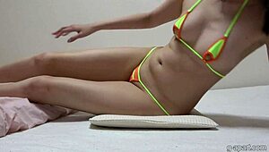 check out sakura misaki's micro bikini wedgie stretching her pussy wide