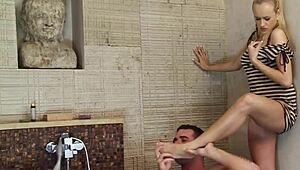 Blonde gives footjob then bends for deep sink fuck and facial