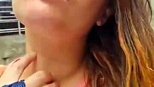 a redhead married woman strolls through the streets of sao paulo in a cage