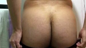 A big ass woman named Nafida poses in a fetish showcase video
