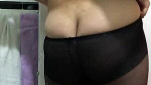 A big ass woman named Nafida poses in a fetish showcase video