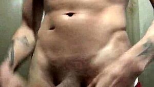 check out this tattooed amateur stud flashing his huge cock for the camera in solo tease