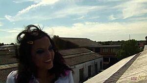 horny lesbian duo in fishnets share massive dildo on rooftop