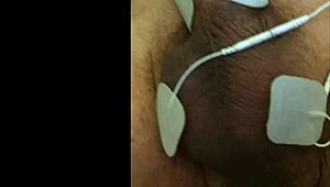 guy tries fisting with electrodi gadget close up