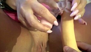 hot russian milf in handcuffs oils up and rams dildo deep