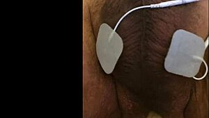 guy tries fisting with electrodi gadget close up