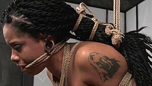 EBONY SLUT SUSPENDED AND BOUND IN GARAGE FOR ROUGH MALEDOM TOY PUNISHMENT