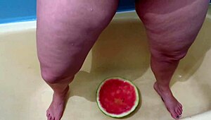 Busty milf bathes in warm piss shower, wet curves glistening in tub