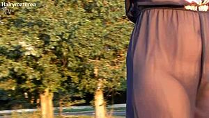 hairy chubby mature flashes her beaver through see-through fabric outdoors