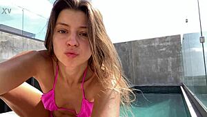 russian babe's natural tits spill from tiny pink bikini