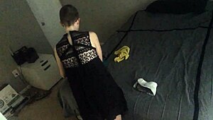 Bald girl folds laundry nude ignoring voyeur on webcam