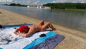 Ariela the Hungarian housewife flashes her shaved pussy outdoors. She rides cock publicly on the Danube bank naked and wild