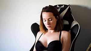 Busty brunette smokes in black bra casually