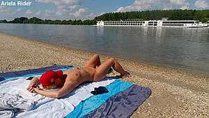 Ariela the Hungarian housewife flashes her shaved pussy outdoors. She rides cock publicly on the Danube bank naked and wild