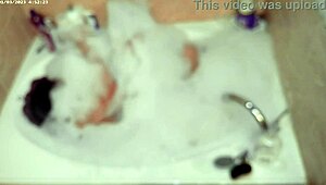 boy relaxes with solo bubble bath in the tub