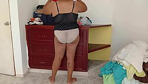 chubby girl tidies room and folds clothes voyeur style