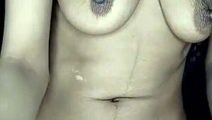 Real homemade first-time curvy milf leaks milk from big natural tits while moaning loud on camera.