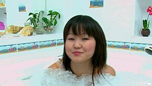 Magna F fingers her shaved pussy horny in the bath tub