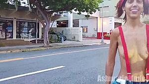 skinny latina flashes her small tits and hairy pussy under suspenders microskirt while topless on the street