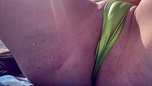 Italian milf flaunts tight shaved pussy closeup at miami public beach