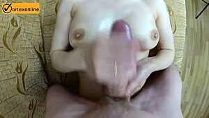 young milf gives perfect oiled handjob and titty fuck with natural big tits