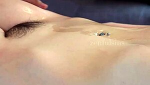 Aveena Axel surrenders to a sensual full-body erotic massage that awakens her deepest desires