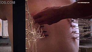 Nurse rosie squirms under mistress april's electro piercing pussy torment