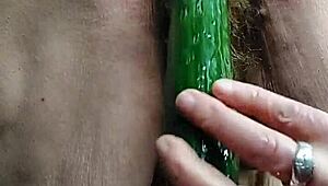 Oma stuffs cucumber deep in her hairy German granny pussy