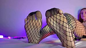 in the bedroom the goth housewife in fishnets gives a teasing footjob pov close up