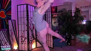 watch this sexy redhead finger herself while pole dancing