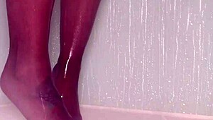 wet nylons cling to teasing toes as she showers pantyhose feet slowly