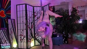 watch this sexy redhead finger herself while pole dancing