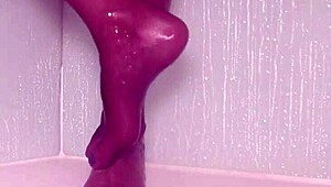 wet nylons cling to teasing toes as she showers pantyhose feet slowly