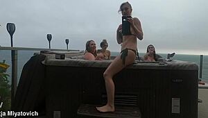 babes splash and play carefree in the backyard hot tub