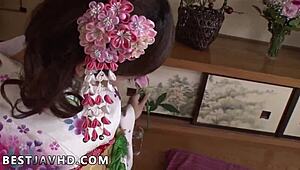 A captivating Japanese beauty indulges in a steamy solo camera session with playful vibes