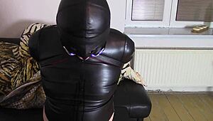 bound crossdresser katja drools helplessly in tight leather hood bondage