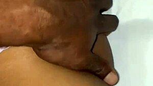 A beautiful black amateur slowly takes off panties in bedroom